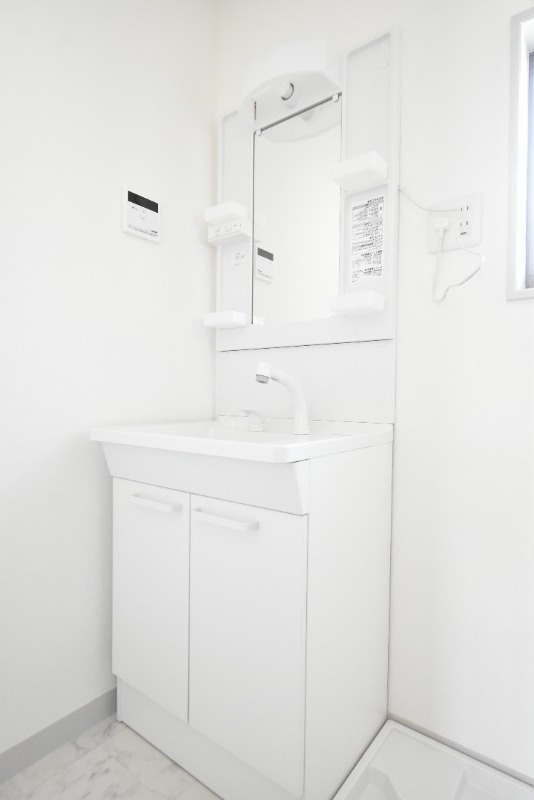 ��ʌ��������܎s�k����i���Q���ڂ̃A�p�[�g�̐��ʏ�