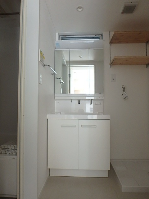 ��ʌ��������܎s�k����i���Q���ڂ̃A�p�[�g�̐��ʏ�