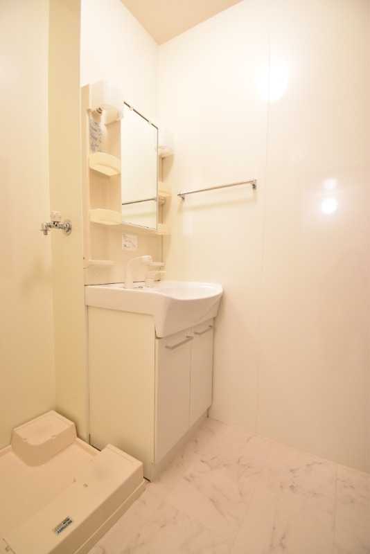 ��ʌ������s�������̃A�p�[�g�̐��ʏ�