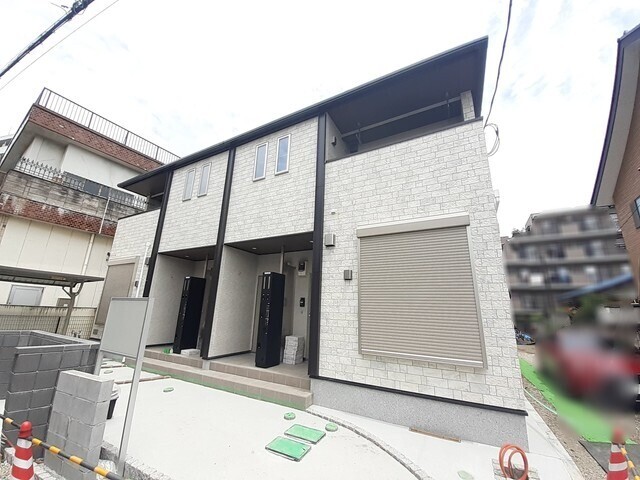 ��ʌ��������܎s�k��{�����̃A�p�[�g�̌����O��