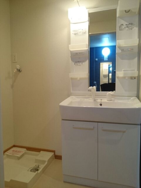 ��ʌ�����s�ђ��̃A�p�[�g�̐��ʏ�