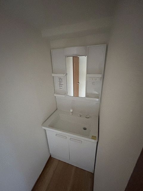 ��ʌ�����s������R���ڂ̃}���V�����̐��ʏ�