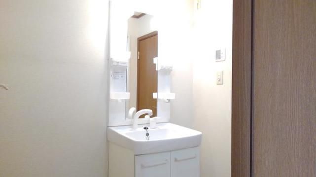 ��ʌ������s�������̃A�p�[�g�̐��ʏ�