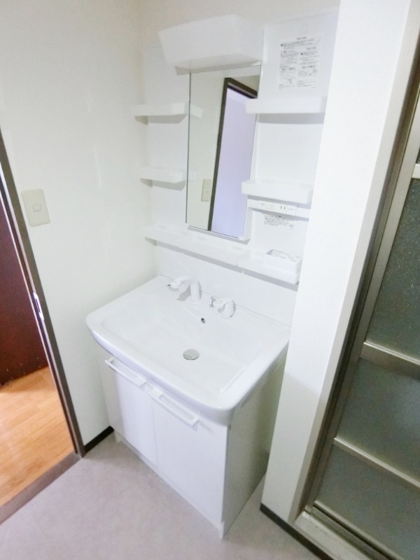 ��ʌ��������܎s������厚����O�̃}���V�����̐��ʏ�