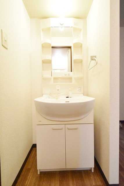 ��ʌ��������܎s��{��㏬���̃A�p�[�g�̐��ʏ�