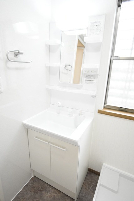 ��ʌ�����s�厚�����̃A�p�[�g�̐��ʏ�