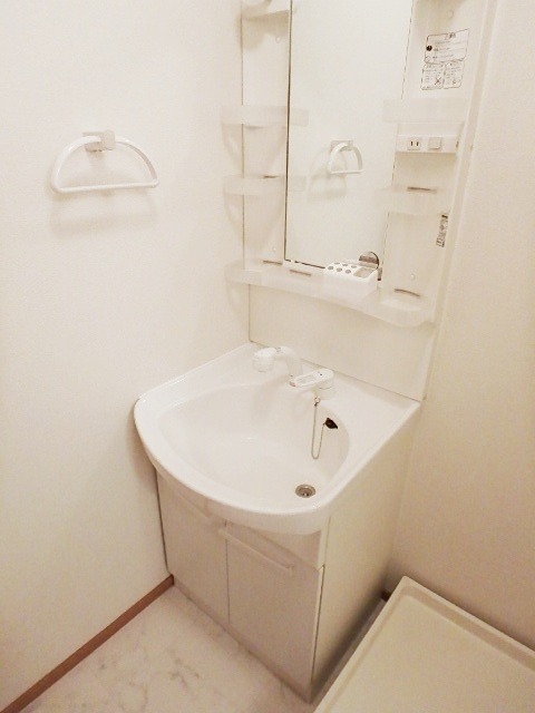 ��ʌ��������܎s��{����ؒ��S���ڂ̃}���V�����̐��ʏ�