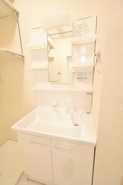 ��ʌ��������܎s��{��㏬���̃A�p�[�g�̐��ʏ�